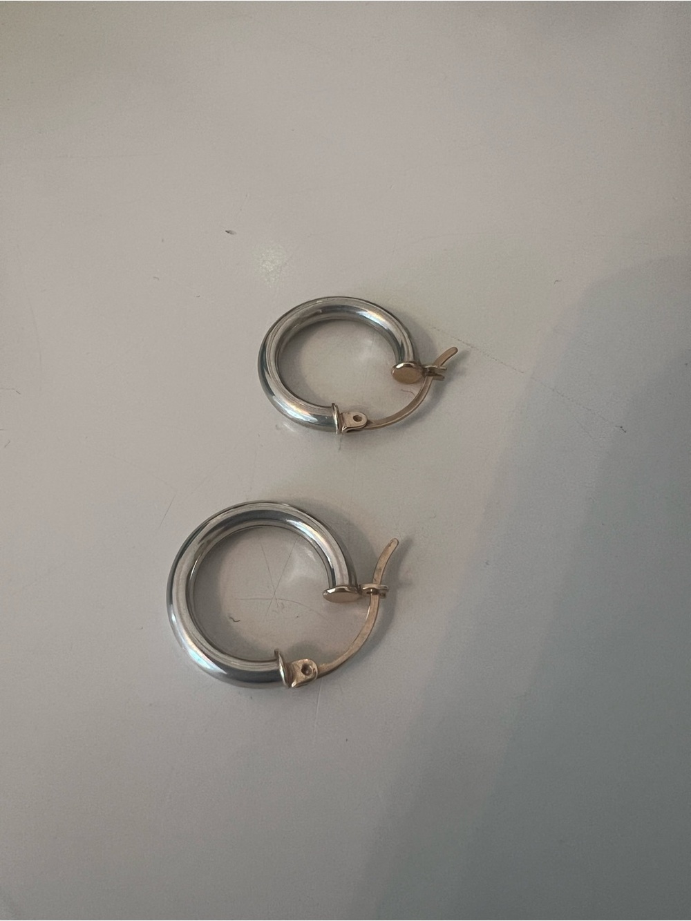 Sterling silver Hoop Earrings with Gold-Hinges. Will not tarnish.